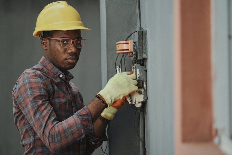 Industrial electrician performing contracting work