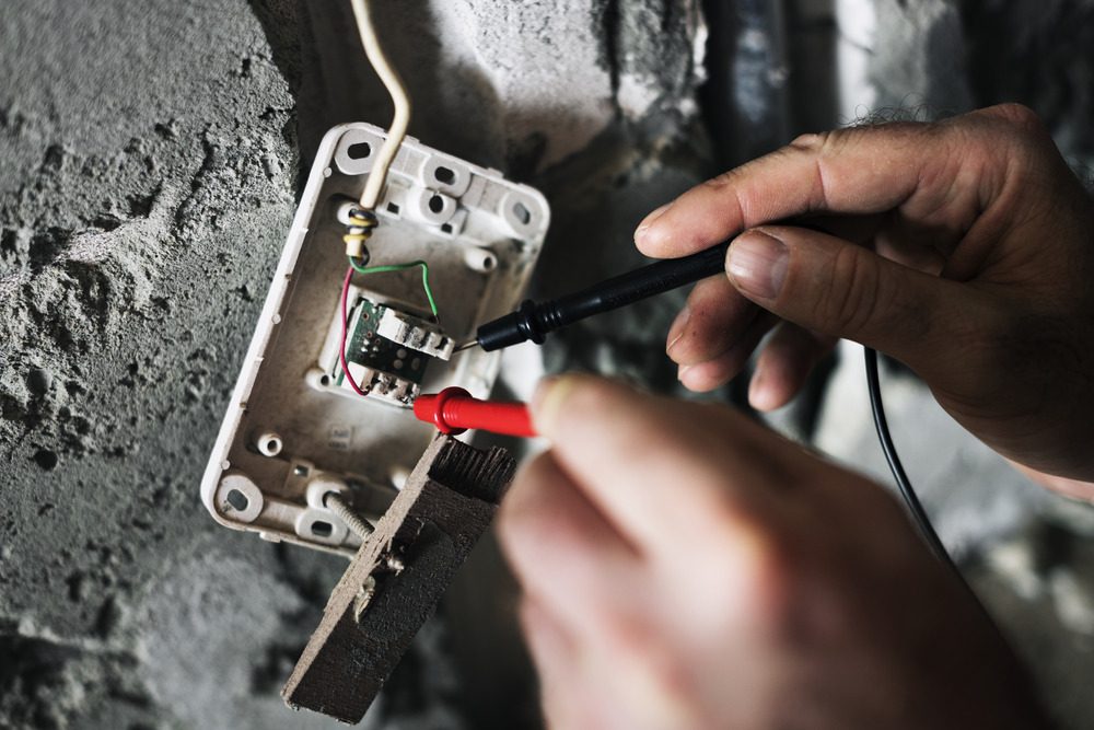 Electrician working on wiring, demonstrating the skills required for smart home installations